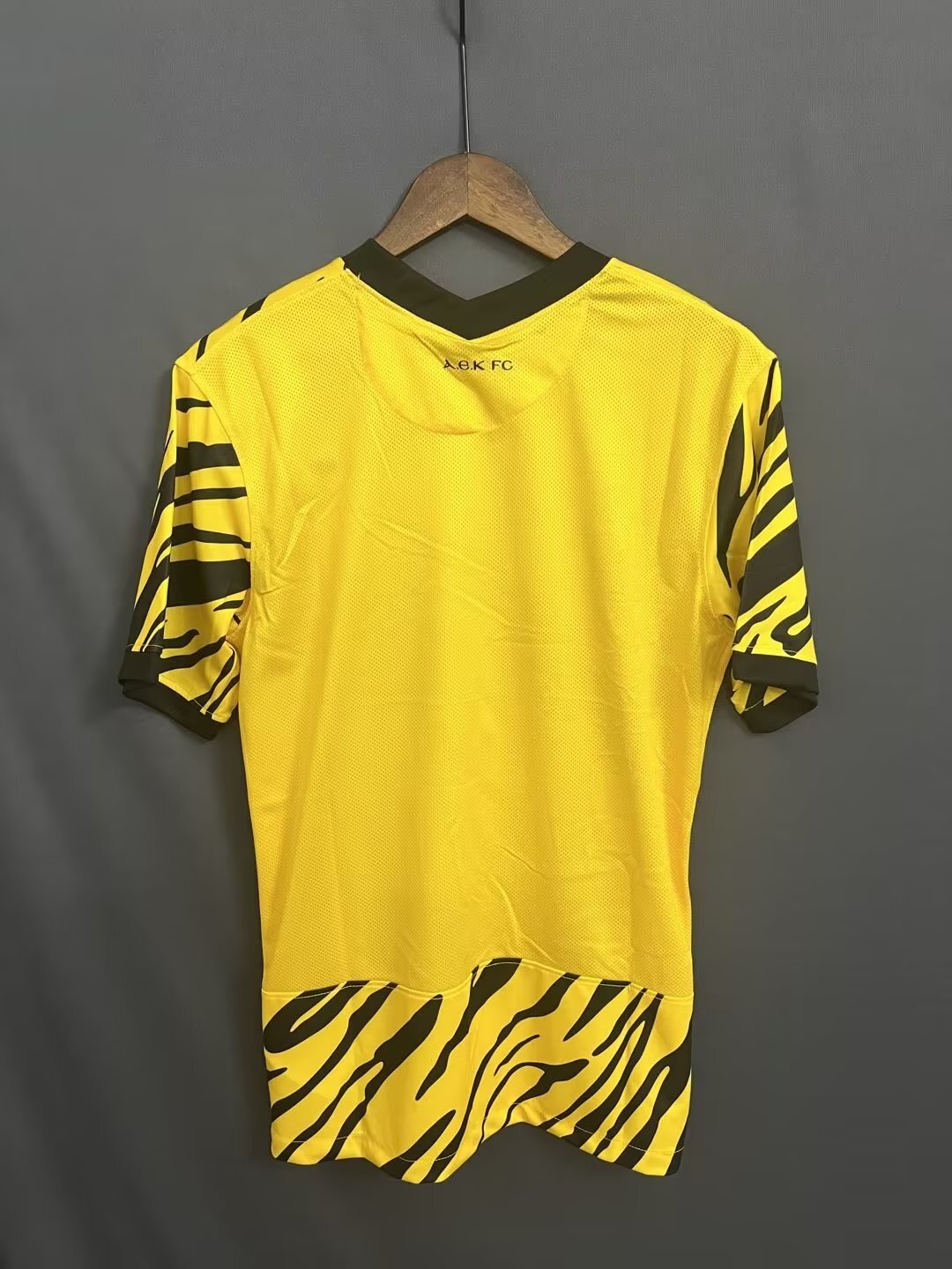 AEK F.C. 22-23 AEK Yellow Style 1 Soccer Jersey sports jersey product view 1