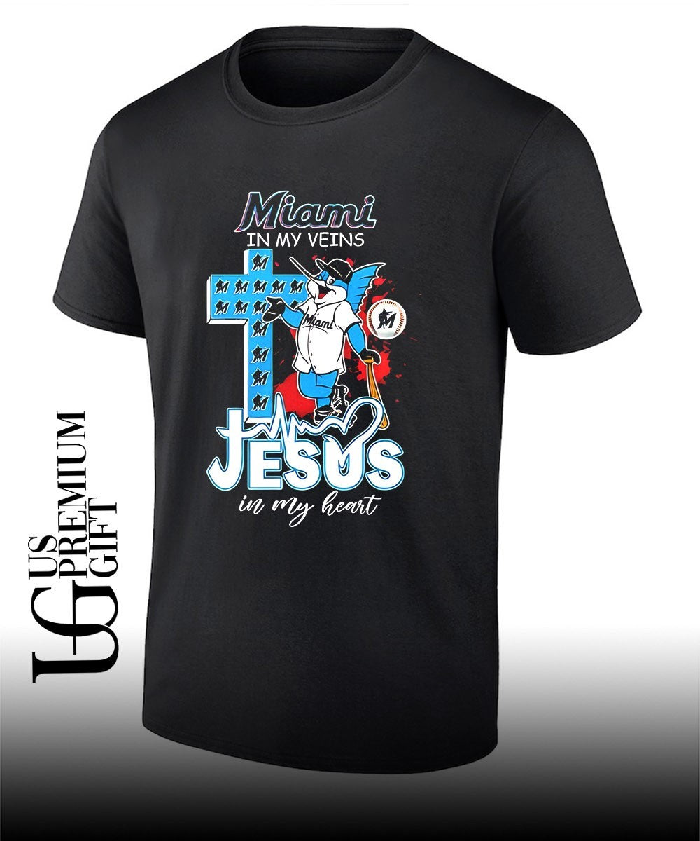 Miami Marlins In My Veins Jesus In My Heart mascot shirt Unisex T-shirt, Sweatshirt, Hoodie, Long Sleeve Tee - T-Shirt, Sweatshirt, Hoodie