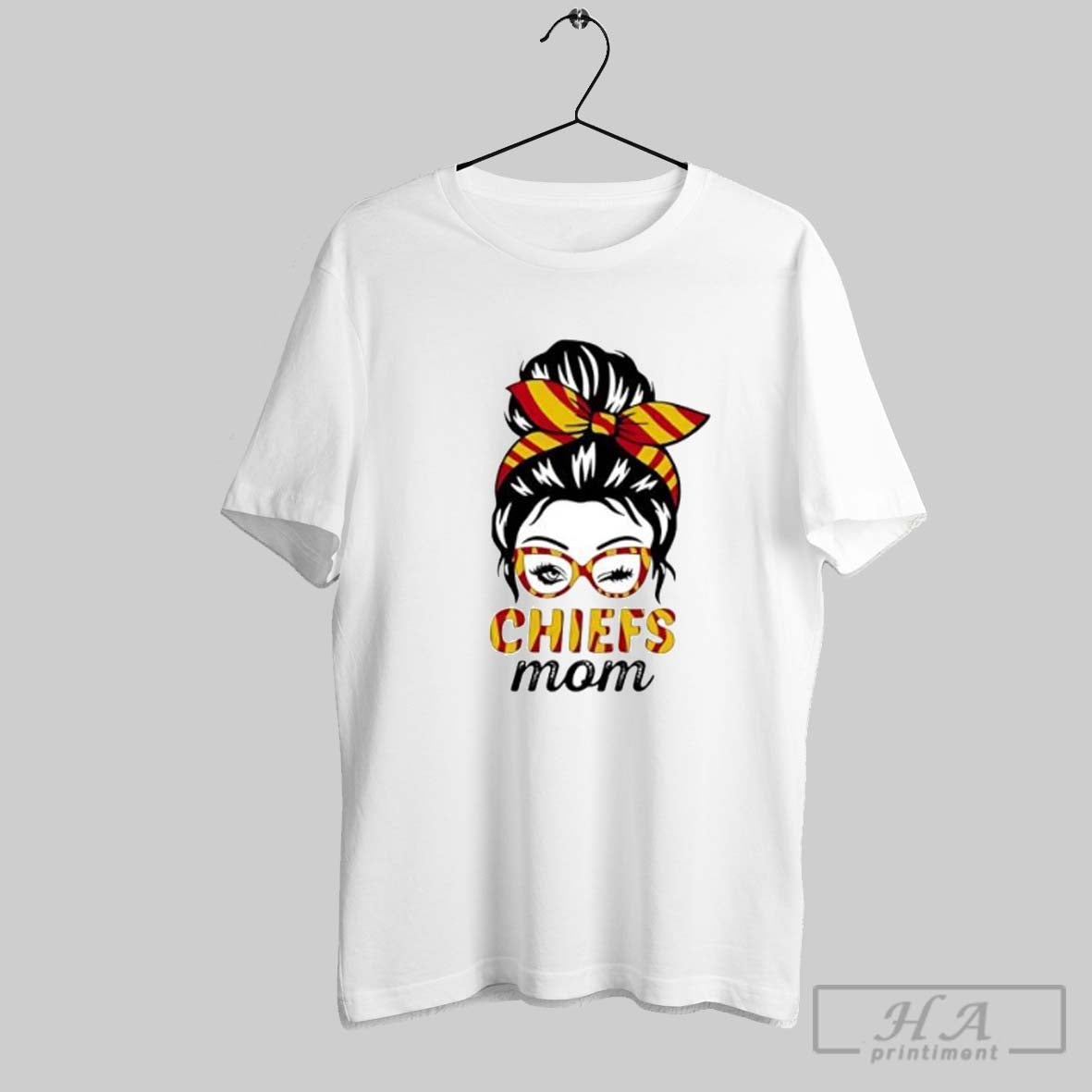 Official Chiefs Mom Winking Eye Messy Bun Leopard Print Football Posters White Unisex T-shirt, Sweatshirt, Hoodie, Long Sleeve Tee - T-Shirt, Sweatshirt, Hoodie