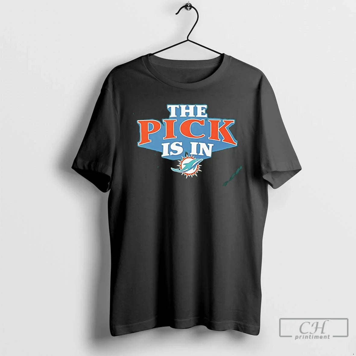 Premium The Pick Is In Miami Dolphins 2026 Unisex T-shirt, Sweatshirt, Hoodie, Long Sleeve Tee - T-Shirt, Sweatshirt, Hoodie