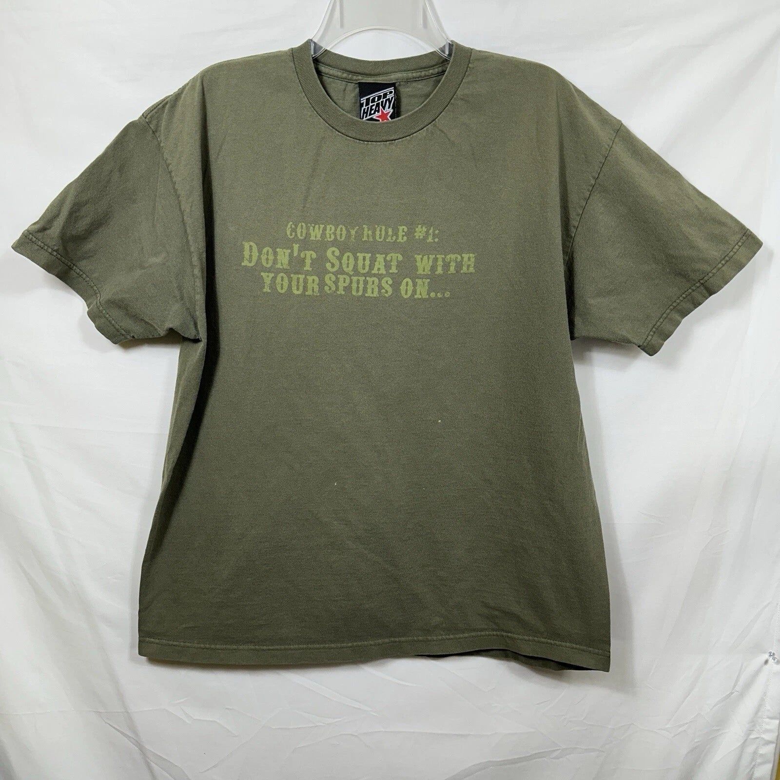 Vtg Top Heavy Y2K Novelty T-Shirt Cowboy Rule #1 Don't Squat with your Spurs on Unisex T-shirt, Sweatshirt, Hoodie, Long Sleeve Tee - T-Shirt, Sweatshirt, Hoodie
