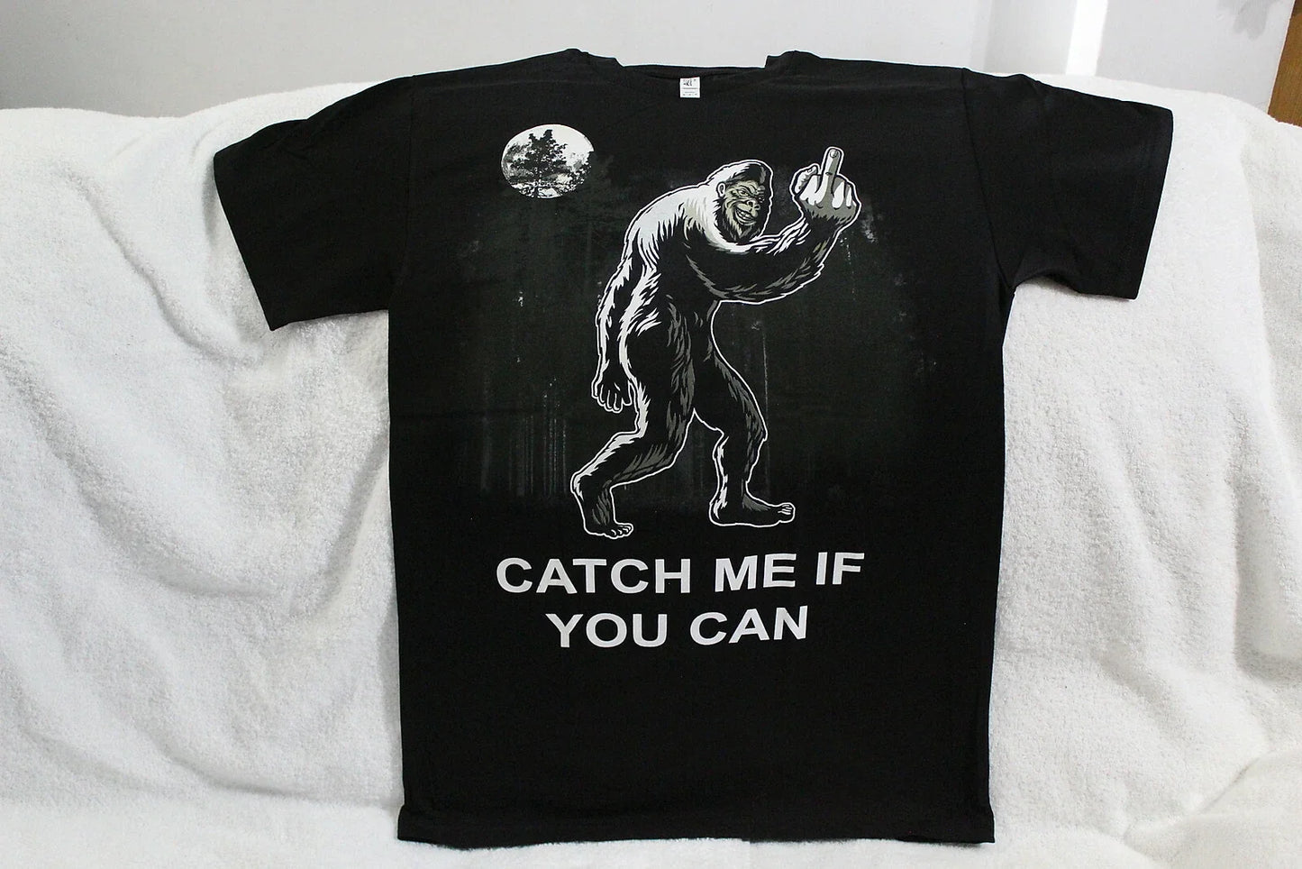 BIGFOOT CATCH ME IF YOU CAN FLIP OFF MIDDLE FINGER SASQUATCH FUNNY T-SHIRT Unisex T-shirt, Sweatshirt, Hoodie, Long Sleeve Tee - T-Shirt, Sweatshirt, Hoodie