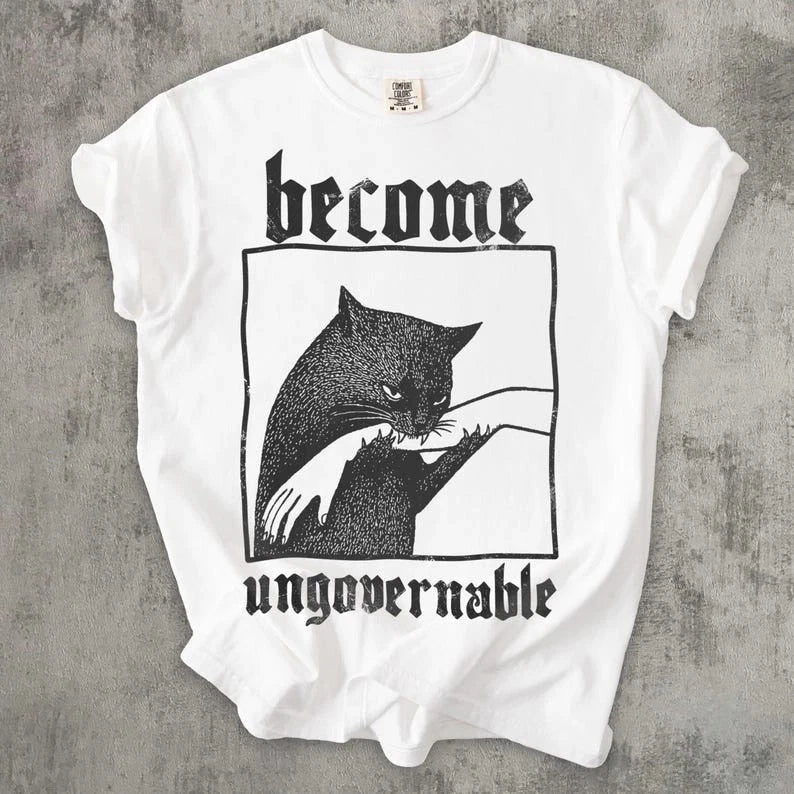 Become Ungovernable Cat Meme Shirt Biting Hand Funny Rebel Graphic Tee Unisex T-shirt, Sweatshirt, Hoodie, Long Sleeve Tee - T-Shirt, Sweatshirt, Hoodie