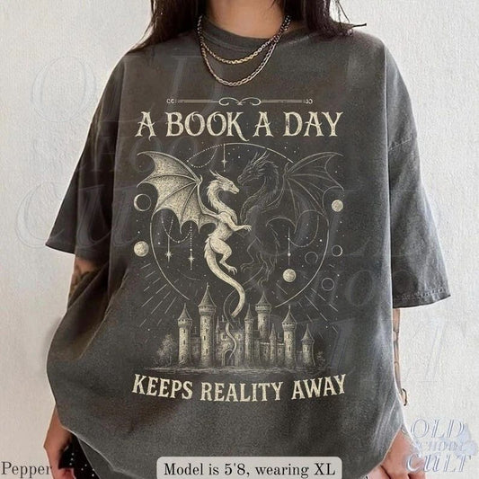 A Book A Day Keeps Reality Away Shirt, Dragon Fantasy Graphic Tee Size S-3XL Unisex T-shirt, Sweatshirt, Hoodie, Long Sleeve Tee - T-Shirt, Sweatshirt, Hoodie